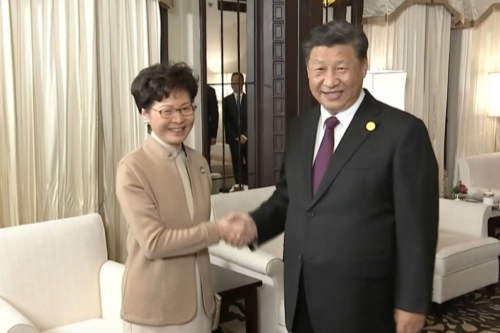 TRUST. This video grab taken from footage released by China Central Television (CCTV) shows Chinese President Xi Jinping (right) and Hong Kong Chief Executive Carrie Lam shaking hands during their meeting in Shanghai on November 4, 2019. Handout/China Central Television/AFP  