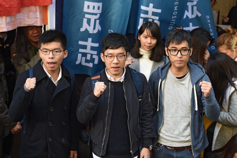 DEMOCRACY ACTIVISTS. In this file photo taken on January 16, 2018 bailed Hong Kong democracy activists Joshua Wong (L), Nathan Law (C) and Alex Chow face the media outside the Court of Final Appeal before their first appeal hearing against jail sentences in Hong Kong. File photo by Anthony Wallace/AFP  