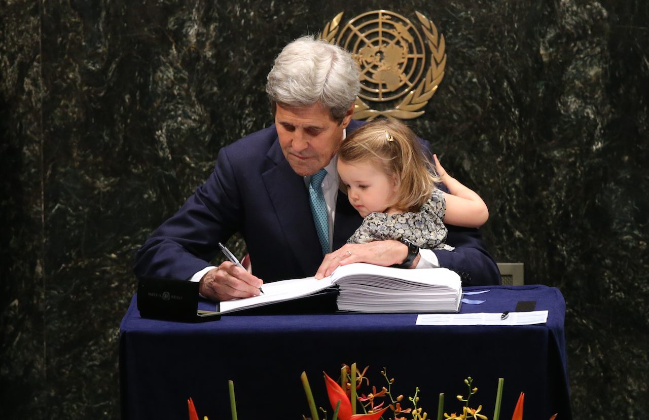 SIGNED. US Secretary of State John Kerry (L) holds his granddaughter Isabelle Dobbs-Higginson after signing the Paris Aggrement at the High-Level Event for the Signature of the Paris Agreement at the United Nations Headquarters in New York, New York, USA, 22 April 2016. Photo by Andrew Gombert / EPA 