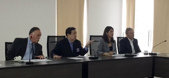 CAPTIVE AUDIENCE. Ambassador of Canada to the Philippines, H.E. Neil Reeder; Chairman and CEO of the Philippine Red Cross, Senator Richard Gordon, and Secretary General of the Philippine Red Cross, Dr. Gwendolyn Pang, listen to the delegates. 