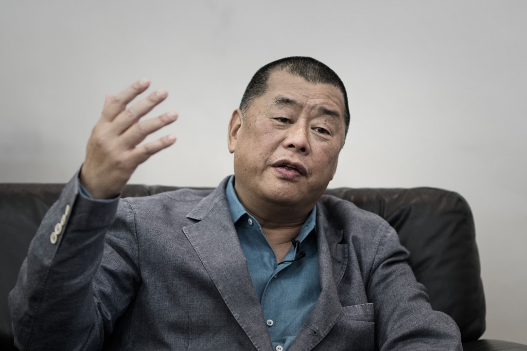 ARRESTED. This photograph taken on June 19, 2015 shows media tycoon Jimmy Lai gesturing during an interview in Hong Kong. Photo by Philippe Lopez/AFP 