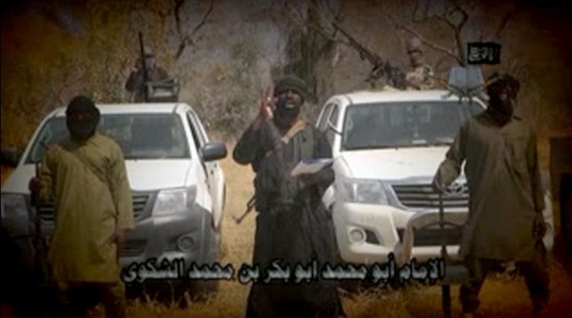 BOKO HARAM. In this screen grab image taken on February 9, 2015 from a video made available by Islamist group Boko Haram, leader Abubakar Shekau (C) makes a statement at an undisclosed location. Boko Haram/AFP 