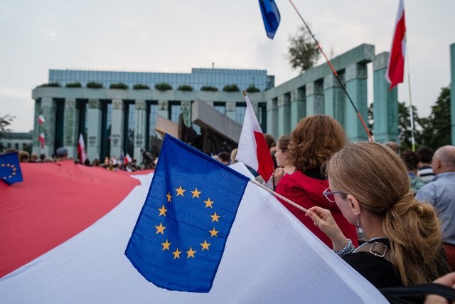 PROTESTS. In this file photo, protesters hold Polish and European Union flags as they take part in a demonstration in front of the Polish Supreme Court on July 21, 2017 in protest against new bill changing the judiciary system. Wojtek Radwanski/AFP 