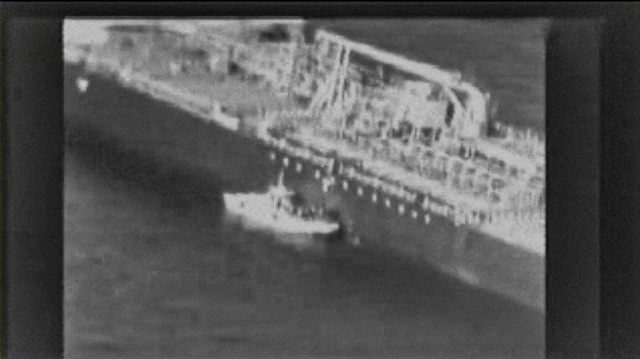 TANKERS. This grab taken from a video released by the US Central Command (USCENTCOM) on June 13, 2019, reportedly shows an Iranian navy patrol boat in the Gulf of Oman approaching the Japanese operated methanol tanker Kokuka Courageous and removing an unexploded mine. File photo from US Central Command/AFP  