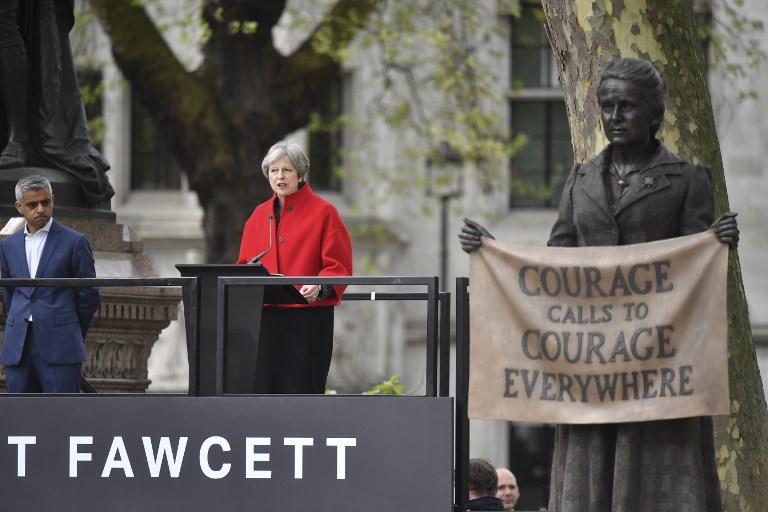 SUFFRAGIST. Britain's Prime Minister Theresa May (center) speaks as London Mayor Sadiq Khan listens during the unveiling of a statue of suffragist and women's rights campaigner Millicent Fawcett by British artist Gillian Wearing in Parliament Square in London on April 24, 2018. Photo by Ben Stansall/AFP 