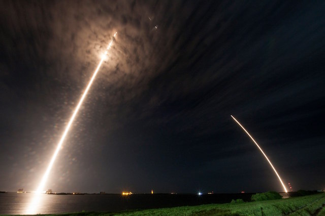DRAGON AND FALCON. A multiple exposure photo showing the trail of the Dragon spacecraft as it lifts off, with the Falcon 9 rocket's trail as it landed, at Cape Canaveral, Florida, July 18, 2016. Photo courtesy SpaceX 