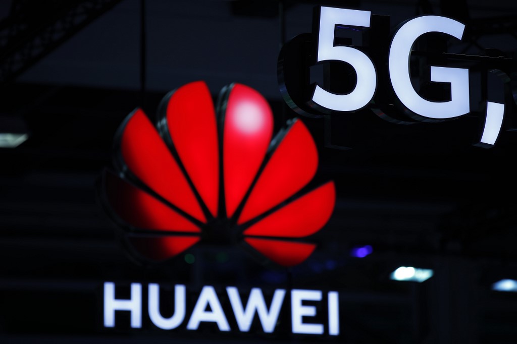 HUAWEI 5G. Illuminated Huawei and 5G signs are on display during the 10th Global mobile broadband forum hosted by Chinese tech giant Huawei in Zurich on October 15, 2019. File photo by Stefan Wermuth/AFP 