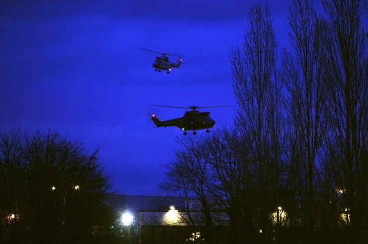 SECURITY OPERATION. Helicopters fly over buildings in Dammartin-en-Goele, north-east of Paris, after two brothers suspected of slaughtering 12 people in an Islamist attack on French satirical newspaper Charlie Hebdo were shot dead by police, on January 9, 2015. Dominique Faget/AFP