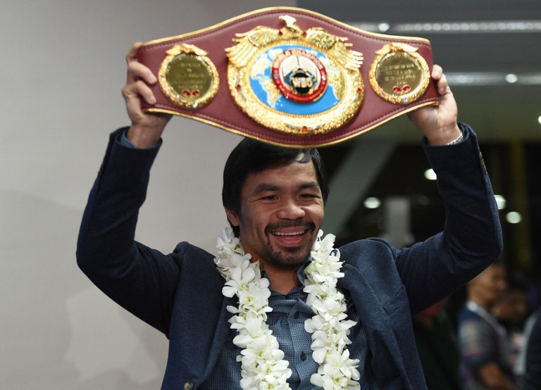 STILL GOING. Manny Pacquiao has people talking about a Mayweather rematch after beating Jessie Vargas to reclaim the WBO welterweight title. Photo by Ted Aljibe/AFP 