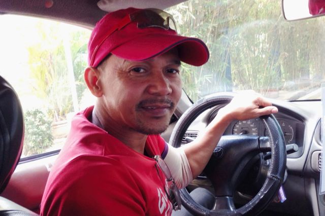 NOT THE USUAL DRIVER. For Jhun Ochavo, the care he extends to his passengers' welfare comes back to him tenfold, allowing him to send his children to school. Photo by Katerina Francisco/Rappler 