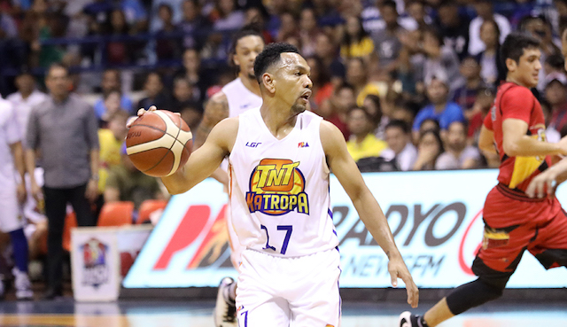 HEART AND SOUL. Jayson Castro displays his veteran savvy as TNT turns back San Miguel for the playoff incentive. Photo from PBA Images  