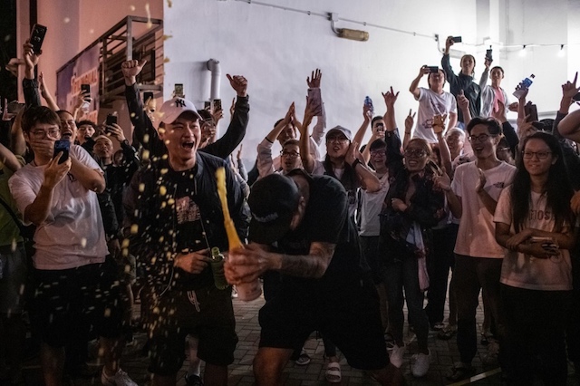 JUBILATION. Pro-democracy supporters chant as they celebrate after pro-Beijing candidate Junius Ho lost a seat in the district council elections in Tuen Mun district of Hong Kong, early on November 25, 2019. Photo by
Philip Fong / AFP  
