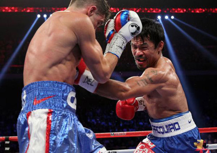 RELENTLESS. Manny Pacquiao lands a body blow on Chris Algieri. Photo from Pacquiao's Twitter account