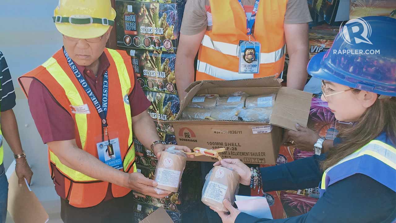 Customs Commissioner Rey Guerrero and District Collector Maritess Martin show some of the smuggled goods confiscated at the Port of Subic on April 26, 2019. Photo by Randy Datu/Rappler 