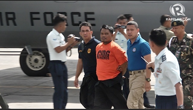 ARRESTED: Ali Mohammad Tambako is brought to Manila for inquest. Rappler photo 