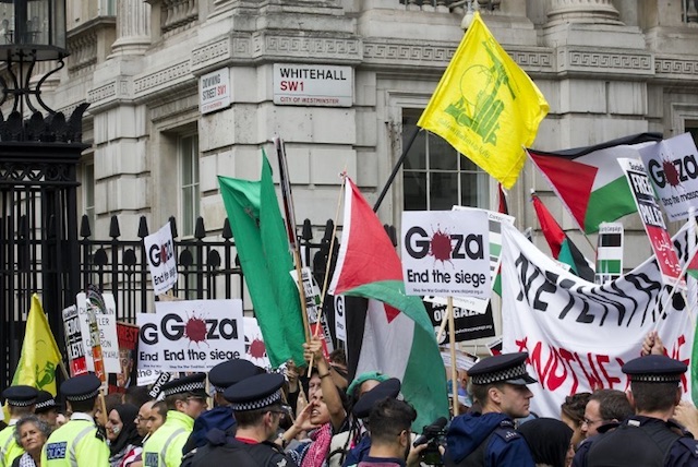 LONDON RALLY. This file photo shows pro-Palestinian demonstrators with Palestinian flags, placards, and the yellow flag of Lebanese Shiite militant group Hezbollah at a  rally in London. Photo by Justin Tallis/AFP  