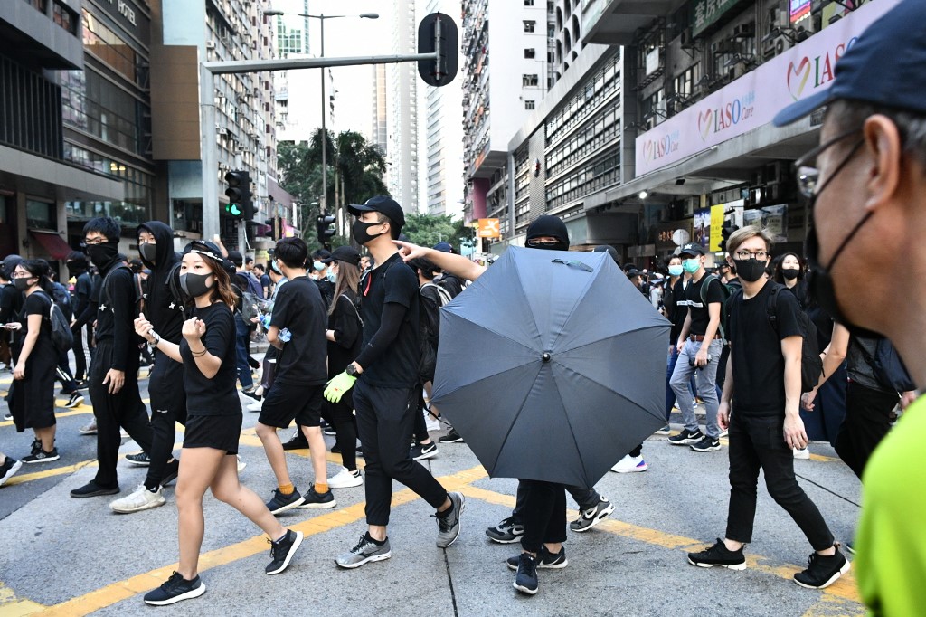 DEFIANCE. Pro-democracy protesters participate in a rally as they march through Hong Kong's Wanchai district on November 2, 2019. Hong Kong police fired tear gas and water cannon Saturday as thousands of protesters hit the streets, defying authorities with another unsanctioned march as the democracy movement shows no signs of abating after nearly five months. Photo by Anthony Wallace / AFP 