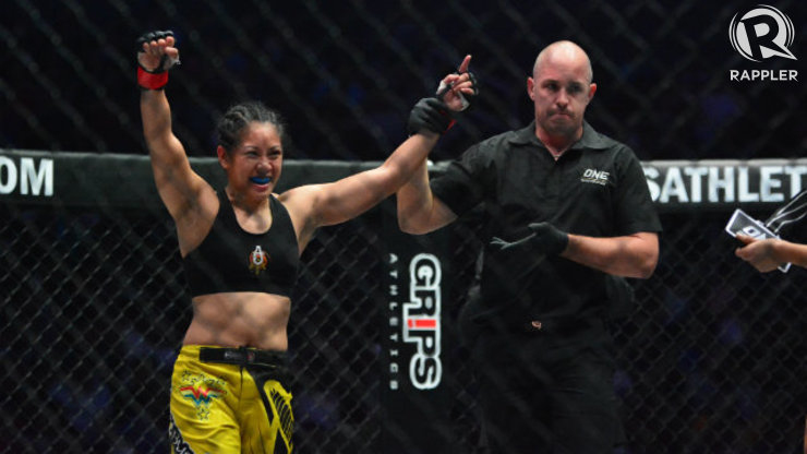Ana Julaton has her hand raised by the referee after being named the winner. Photo by Nevin Reyes/Rappler