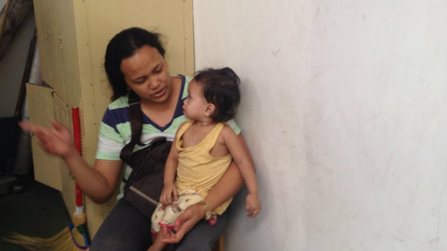 BETTER. Liezel's daughter, Clarissa Mae, with one of Young Focus' volunteers.  