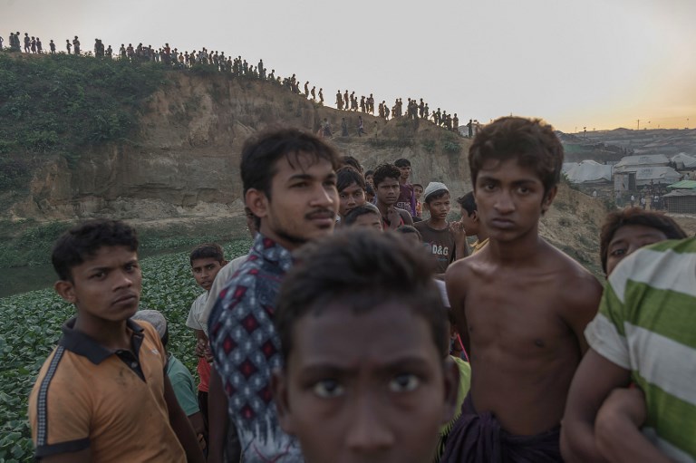ROHINGYA. This picture taken on November 26, 2017 shows Rohingya Muslim refugees looking on near Kutupalong refugee camp in Cox's Bazar, Bangladesh. File photo by Ed Jones/AFP 