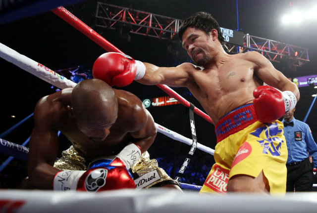 A Mayweather vs Pacquiao rematch could take place in 2016. Photo by Chris Farina - Top Rank  