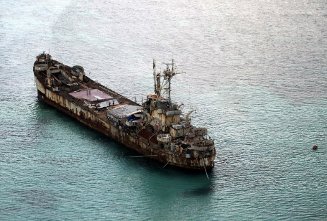 BRP SIERRA MADRE. This aerial photo taken from a military aircraft shows the Sierra Madre ship of the Philippine Navy anchored near Ayungin Shoal (Second Thomas Shoal) with Philippine soldiers onboard to secure the perimeter in the Spratly Islands, on May 11, 2015. File photo by Ritchie Tongo/AFP   