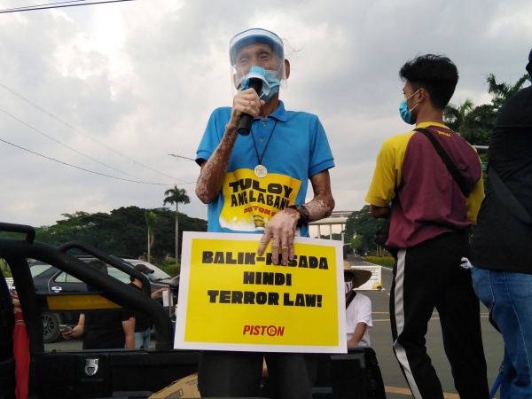 NO TO ANTI-TERROR LAW. One of the 6 arrested jeepney drivers Elmer Cordero of transport group Piston joins the mobilization in UP Diliman encouraging Filipinos to continue their calls to junk the anti-terror law that stifle poor's legitimate dissent. Photo from Philippine Collegian 