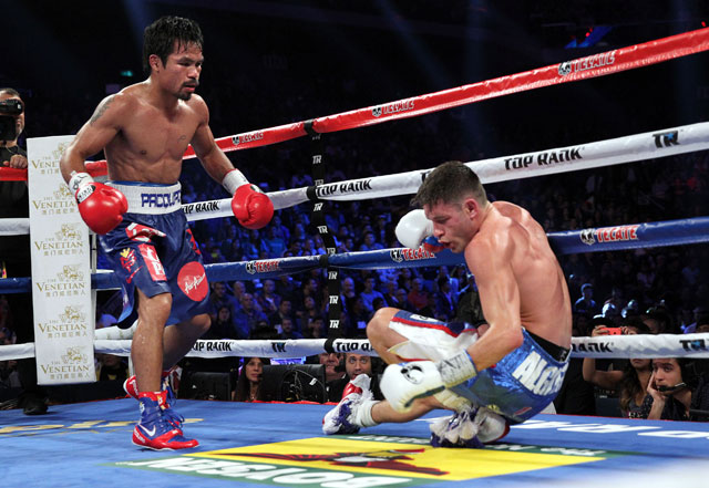 KNOCKDOWN. Pacquiao looks on after knocking down Algieri. Photo by Chris Farina/Top Rank