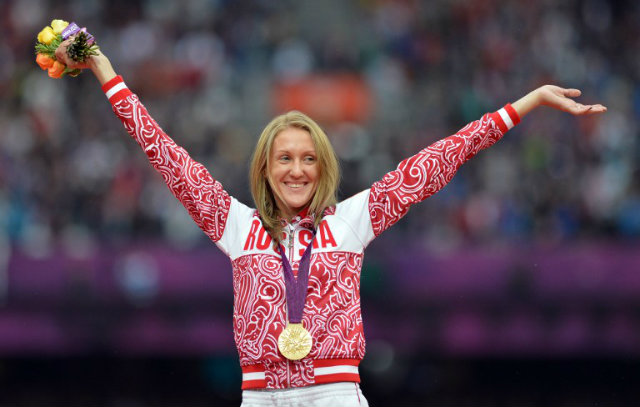 DOPING. Russia's gold medalist Yuliya Zaripova, seen in this file photo celebrating on the podium of the women's 3000m steeplechase at the athletics event during the London 2012 Olympic Games, is caught in a retroactive doping test. JOHANNES EISELE / AFP 
