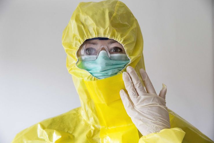 PROTECTION. A person wears protective clothing from a health kit from Cordaid, a Catholic organization for relief and development aid, destined for Sierra Leone, in Gouda, The Netherlands, 26 October 2014. Photo by Arie Kievit / EPA