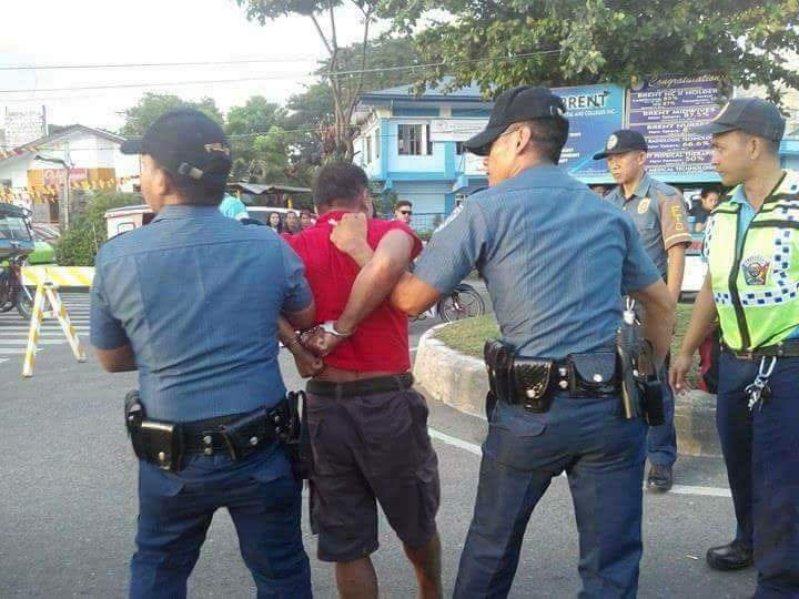 ARREST. Police prepare to bring Eduardo Serino Sr to the police station in Zamboanga City. Photo courtesy of Rosherl Taburnal Lumpapac 