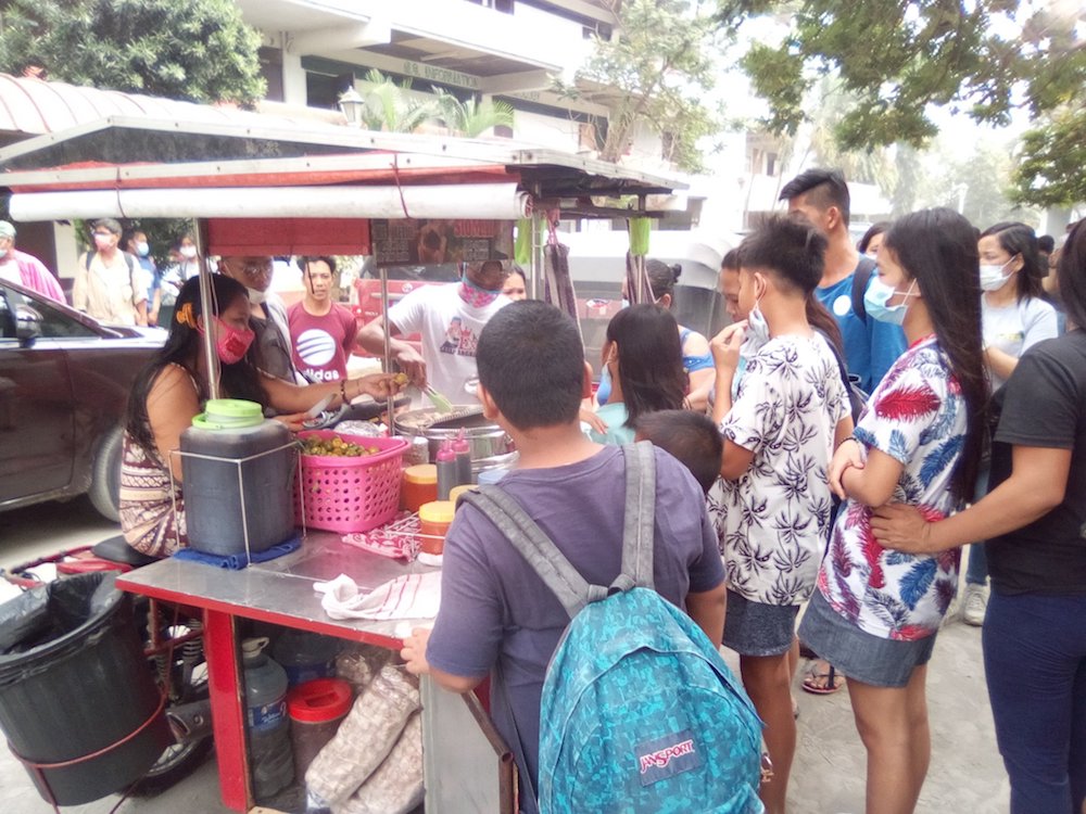 In Sto. Tomas, Batangas, street vendors decide to give up a day of their income to feed the evacuees at the Polytechnic University of the Philippines. Photo by Twitter user @big_bryte 
