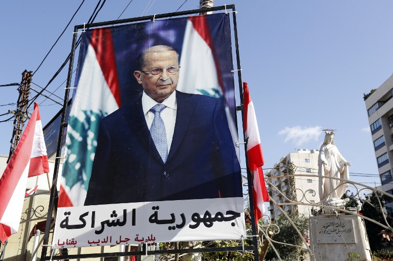 IN LEBANON. A general view shows a large poster of ex-general Michel Aoun ahead of a parliament session expected to elect him as president and end a political stalemate of more than two years, in Jdeidah, on the northern outskirts of the capital Beirut on October 31, 2016. Photo by Anwar Amro/ AFP 