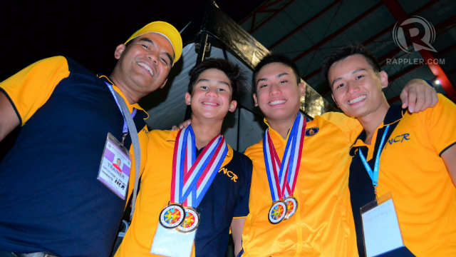 CHAMPIONS. NCR swimmers Miguel Barsilan, Alberto Batungbakal with their coaches. Photo by Jerome Monta/Rappler