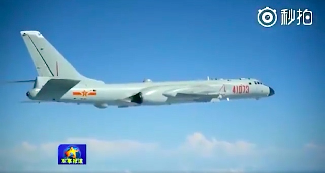 CHINESE BOMBER. A video posted by state-owned People's Daily of China shows a Chinese bomber in takeoff and landing training on an island reef in the South China Sea. Screengrab from People's Daily  
