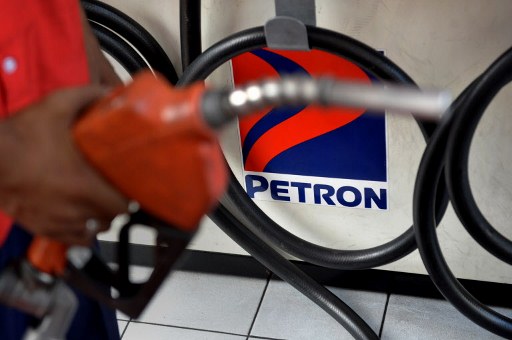 TRAIN LAW. Petron says the excise tax hike not only hurt its earnings, it also encouraged illegal business practices. File photo by Jay Directo/AFP   