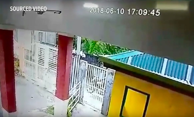 PROOF? CCTV footage shows Adell Milan on his motorbike passing by the gate of T. Ador Dionisio National High School in San Isidro town minutes before Fr Richmond Nilo is gunned down in Zaragoza town, which is about 25 kilometers away. Screengrab from sourced video  