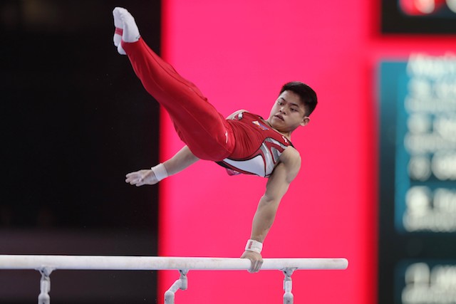 HISTORY. Carlos Edriel Yulo does a difficult routine on the parallel bars of the all-around qualifiers in the 49th FIG Artistic Gymnastics World Championships on Monday, October 7 at the Hans Martin Schleyer Halle in Stuttgart, Germany. Photo from release 