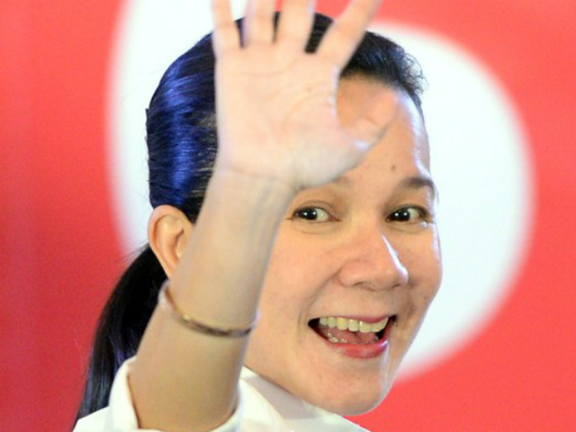 BARRED FROM RUNNING. The Comelec First Division on December 11, 2015, releases a resolution that bars Senator Grace Poe from running for president. File photo by Ted Aljibe/AFP 