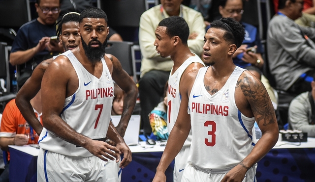 TWIN TOWERS. Jason Perkins (right) and Mo Tautuaa lead the charge for Gilas Pilipinas against Cambodia. Photo by Jerrick Reymarc/Rappler  