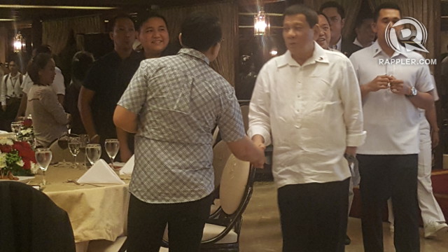 PARTY WITH MEDIA. Upon arriving at the MPC Christmas party, President Rodrigo Duterte goes around greeting his guests. Photo by Pia Ranada/Rappler 