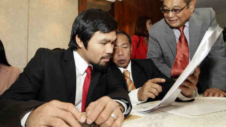 GAG ORDER. A Philippine court decision disallows Manny Pacquiao and the tax bureau to speak about the former's alleged tax evasion case. File photo by Dennis Sabangan/EPA