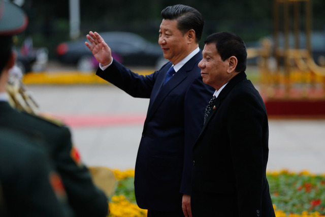 CHINA'S PROMISE. President Rodrigo Duterte is accompanied by China President Xi Jinping during his arrival at the Great Hall of the People in Beijing, China on October 20. Photo by Toto Lozano/PPD 