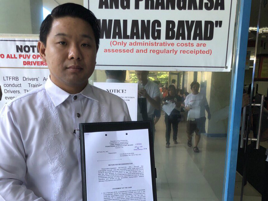 RECONSIDER. Grab Philippines' lawyer John Paul Nabua submits to the LTFRB a motion for reconsideration against the suspension of the P2-per-minute charges. Photo courtesy of Grab Philippines 