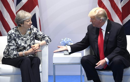 US President Donald Trump and British Prime Minister Theresa May hold a bilateral meeting on the sidelines of the G20 Summit in Hamburg, Germany, July 8, 2017. Photo by Saul Loeb / AFP 