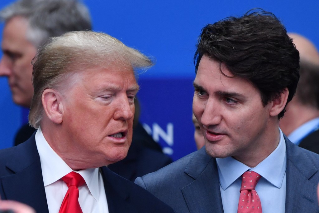 FEUD. US President Donald Trump talks with Canada's Prime Minister Justin Trudeau during the plenary session of the NATO summit at the Grove hotel in Watford, northeast of London on December 4, 2019. Photo by Nicholas Kamm/AFP  
