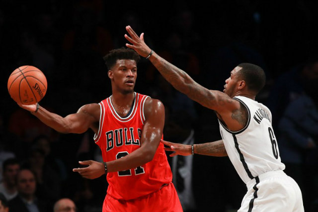 Jimmy Butler of the Chicago Bulls passes the ball against Sean Kilpatrick of the Brooklyn Nets during the first half at Barclays Center on October 31, 2016 in New York City. Michael Reaves/Getty Images/AFP  