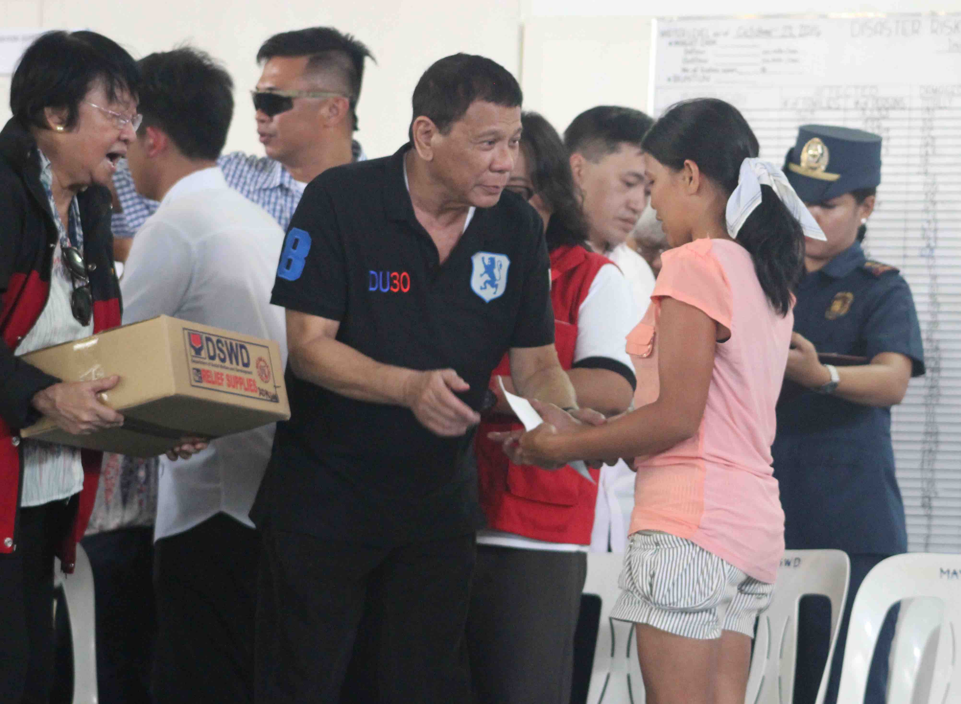 AID DISTRIBUTION. Pres Rodrigo Duterte and DSWD Sec Judy Taguiwalo kick off the distribution of emergency shelter assistance (ESA) in Tuguegarao City and Ilagan City on Sunday, October 23. Photo by Julius Catulin  