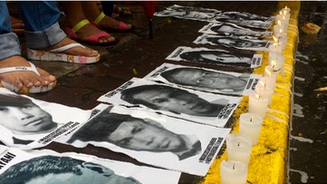 NEVER AGAIN. Protesters display photos of human rights victims during Martial Law to rally against any possible reimposition of martial rule in the country. Rappler file photo  
