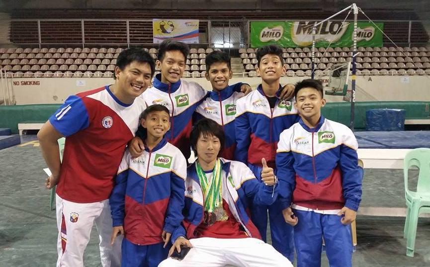EXTENDING HELP. Munehiro Kugimiya (seated, center) trains the Philippine national gymnastics team. Photo from Carlos Yulo's Facebook  
